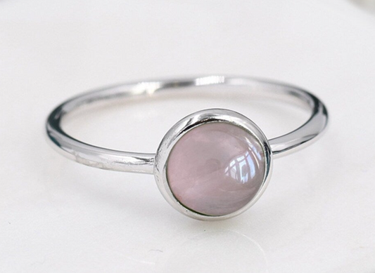 silver ring with a round cabochon with Rose Quartz